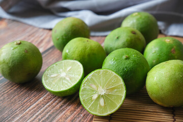 Group of lime with wooden texture background
