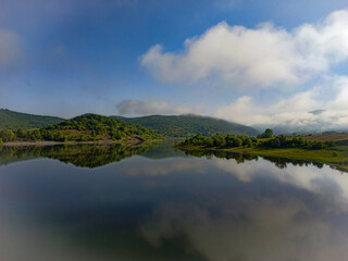 Reflections of an Artificial lake of Potamoi, in Drama town, sunny day
