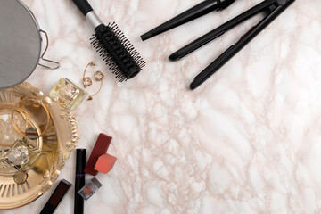 Top view of dressing table and hair dressing tools,make up accessories,mirror on it.Empty space