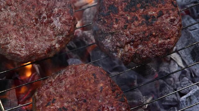 Searing beef burgers for hamburgers on grill p3