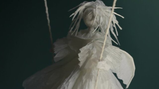 gloomy white voodoo paper puppet 