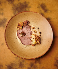 Slowly cooked pork neck, roasted vegetable puree and roasted cauliflower