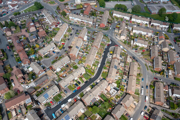 Aerial drone photo of the town of Bramley which is a district in west Leeds, West Yorkshire, England UK, showing residential housing estates and semi detached houses in the summer time - obrazy, fototapety, plakaty