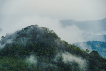 Mountains range in northern Thailand in the rainy season where the rain is falling into the forest.