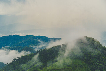 Mountains range in northern Thailand in the rainy season where the rain is falling into the forest.