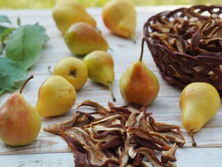 Natural background with dried fruits. Juicy fragrant pears against the backdrop of nature and dried pears.