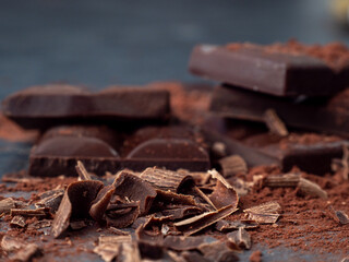 Dark chocolate on a dark background.