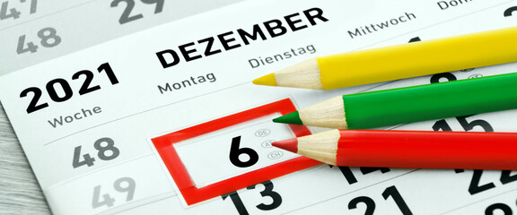 Deutscher Kalender Nikolaus am 6. 12. 2021 und 3 Stifte rot grün gelb