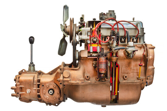 Disassembled vintage car engine with transmission and gear shift isolated on a white background
