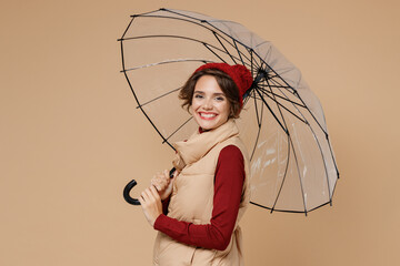 Profile young cool fun woman 20s wear red turtleneck vest beret hold transparent umbrella look...