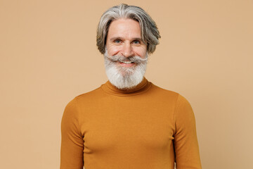 Elderly gray-haired mustache bearded smiling happy man 50s wearing mustard yellow turtleneck shirt...