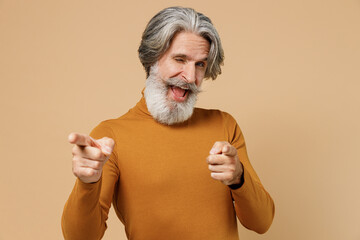 Elderly gray-haired mustache bearded cool man 50s wearing mustard yellow turtleneck shirt point...