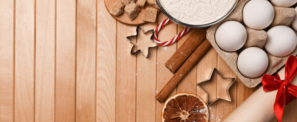 Christmas flatlay on ingredients for baking cookies. Eggs,flour,cinnamon,sugar, star shaped form. Mockup
