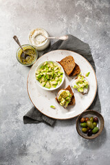 Rye bread avocado and pesto snacks top view