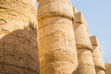 Anscient Temple of Karnak in Luxor - Ruined Thebes Egypt. Huge columns with hieroglyphs in the...