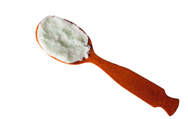 Body scrub with green crystals in wooden spoon. Homemade cosmetic for peeling and spa care. Isolated on white.