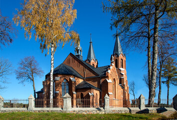 General view and architectural details in a close-up of the Neo-Gothic Catholic Church of Our Lady of the Angels erected in 1921 in the village of Czarna Wieś Kościelna in Podlasie, Poland.