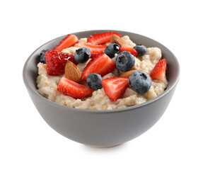 Tasty oatmeal porridge with blueberries, strawberries and almond nuts in bowl on white background