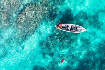 Fototapeta na wymiar Aerial view, fishermen catch fish on the reefs at Cap Malheureux, Grand Gaube, Pamplemousses Region, Mauritius, Africa