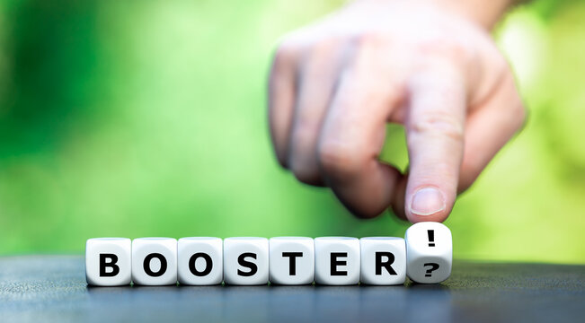 Symbol for a covid booster shot. Hand turns dice and changes the expression "booster?" to "booster!".