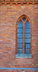Fototapeta na wymiar General view and architectural details in a close-up of the Neo-Gothic Catholic Church of Our Lady of the Angels erected in 1921 in the village of Czarna Wieś Kościelna in Podlasie, Poland.