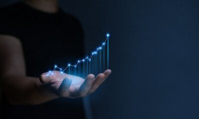Businessman holding growth business graph progress and financial analyzing. Business development to success, profit and growing plan.	