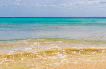 Tropical mexican beach waves turquoise water Playa del Carmen Mexico.