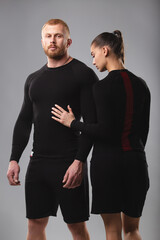 Studio portrait of a young couple in sportswear. Healthy lifestyle