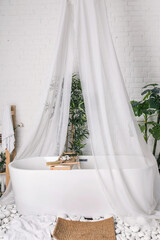 white bathroom with a canopy in the room