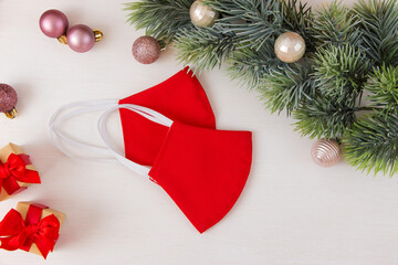 Handmade face mask in red color. Christmas concept.