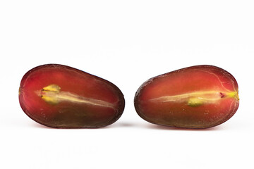 Two sliced grapes isolated on a white background.