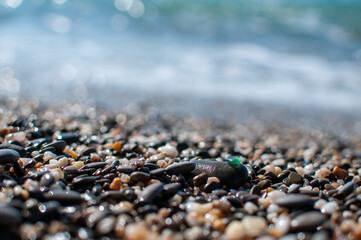 Sea pebbles on the shore close-up.