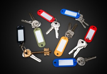 Golden master key, many keys on black floor