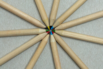 Colored pencils in a row forming a circle. Colored pencils of the same color.