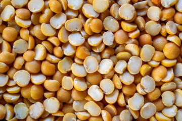 background of shelled peas halves yellow