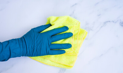 A gloved hand holds a rag. Cleaning concept, cleaning supplies