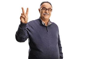 Cheerful mature man gesturing peace sign