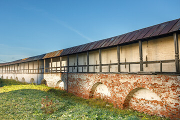 A fragment of a fortress brick wall with loopholes.