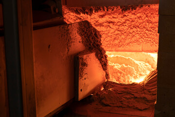 A large melting furnace glass. Glass manufacturing industrial factory. Glass plant.