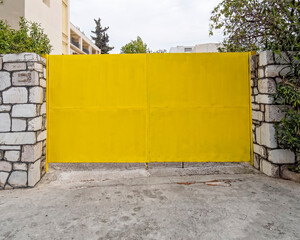 vivid yellow painted metallic garage door