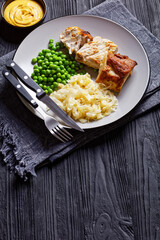 Pork loin and sauerkraut on a plate, close-up