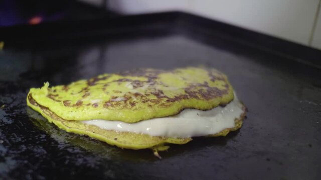 Preparation of a Traditional Venezuelan Dish, Sweet Corn Crepe Cachapa Filled with Cheese