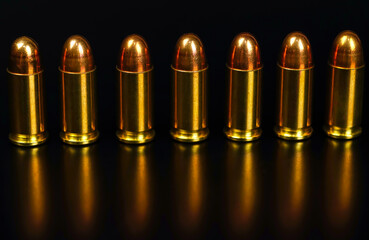 golden bullets on a black background	