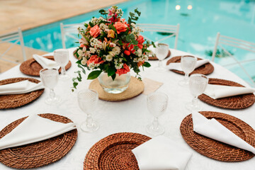 wedding decoration - table set with plates, cutlery and glasses