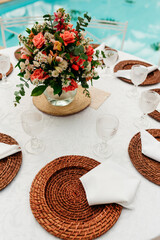 wedding decoration - table set with plates, cutlery and glasses