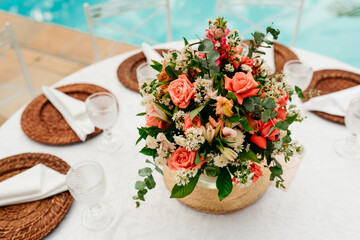 wedding decoration - table set with plates, cutlery and glasses