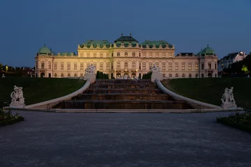 Deurstickers Famous Belvedere castle (Schloss Belvedere) surrounded by gardens with fountains and classic statues at night, Vienna, Austria © JMDuran Photography
