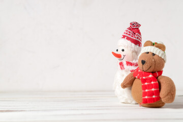 Toy snowman and Christmas toy on a white background. Place for your text.