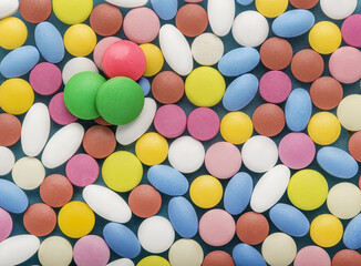 Heap of medical pills in white, blue and other colors.  Concept of healthcare and medicine.