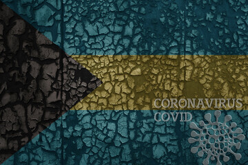 flag of bahamas on a old metal rusty cracked wall with text coronavirus, covid, and virus picture.